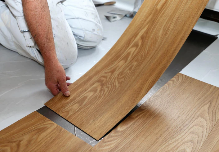 man hands livingroom vinyl flooring frisco tx